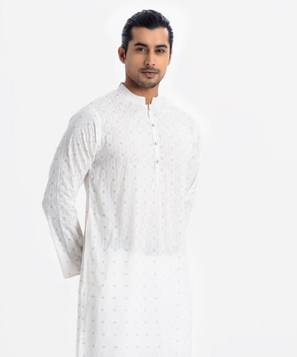 Men's semi fitted panjabi in cotton fabric. Line stitching at mandarin collar and placket. Inseam pockets. All over printed.