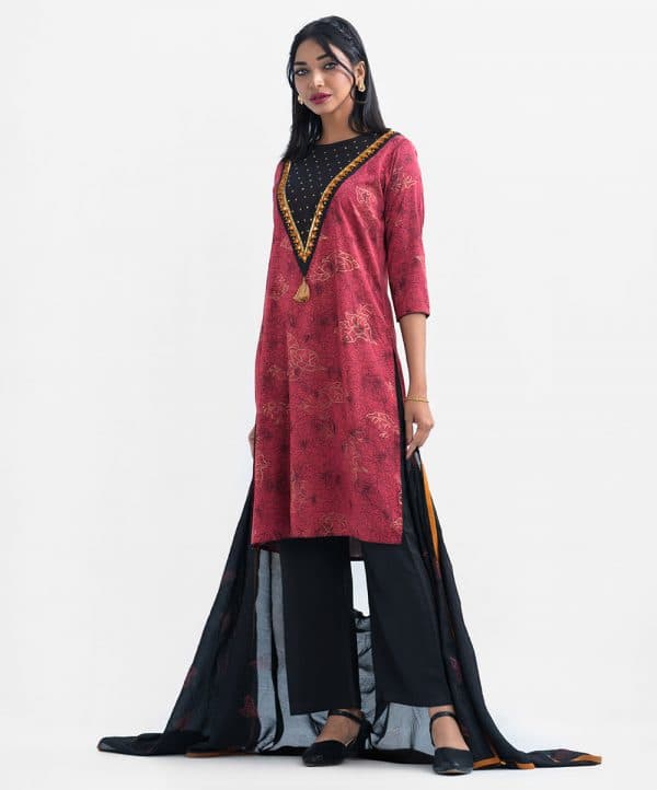 Women's exclusive salwar kameez from Nargisus by Le Reve in jacquard fabric. Round neck, three-quarter sleeved and karchupi at the front with tassel. Complemented with crepe palazzo and georgette dupatta.
