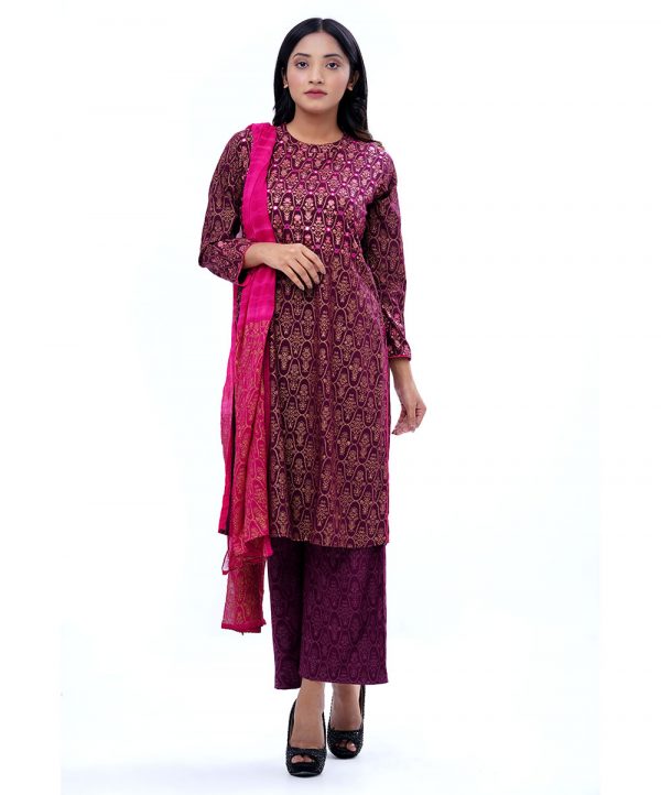 Burgundy all-over printed Salwar Kameez in Viscose fabric. The Kameez features a round neck and three-quarter sleeves. Embellished with karchupi at the top front. Complemented by all-over printed palazzo pants and tie-dye chiffon dupatta