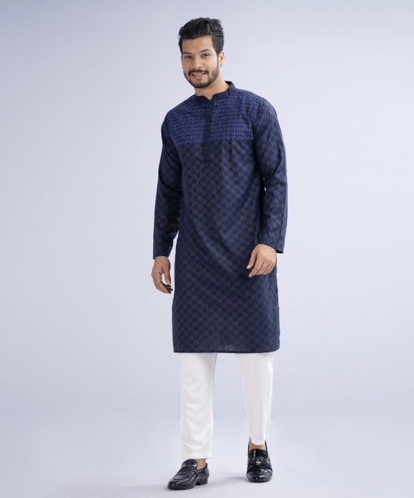 Blue fitted Panjabi in Cotton fabric. Designed with a mandarin collar and matching metal buttons on the placket. Embellished with minimal embroidery on the chest.