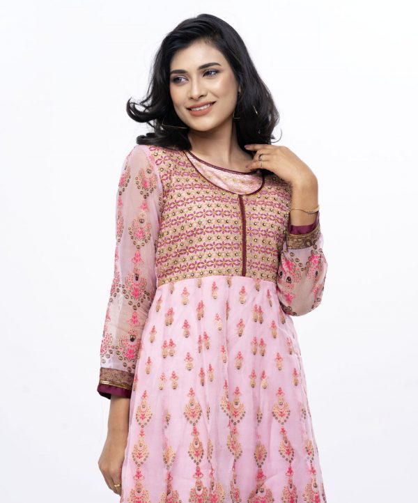 Pink Anarkali style Tunic in Muslin and Crepe fabric with all-over ornaments print & heavy karchupi on top front and sleeves.