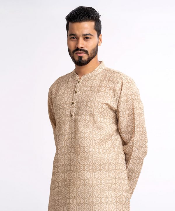 Golden brown fitted Panjabi in Art-sik fabric. Designed with a mandarin collar and matching metal buttons on the placket.
