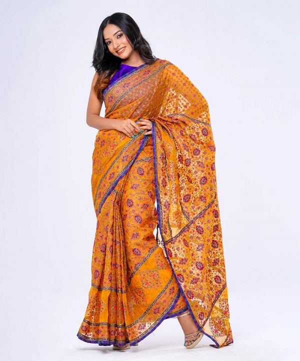 Yellow all-over printed exclusive Saree in Muslin fabric with a purple border. Embellished with karchupi, on the achal.