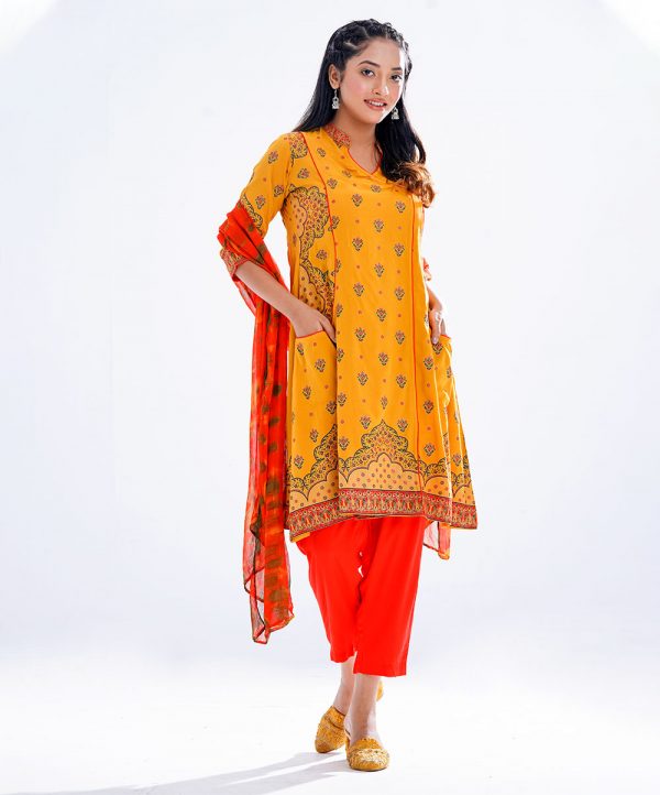 Yellow and Orange all-over printed Salwar Kameez in Viscose fabric. The retro wrap style Kameez features a half-band neck and three-quarter sleeves. Designed with front pockets. Complemented by culottes pants and tie-dye chiffon dupatta.