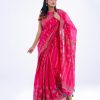 Pink all-over printed exclusive Saree in Half-silk fabric. Embellished with karchupi, and decorative tassels on the achal.