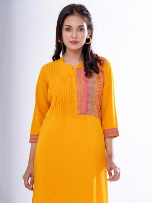 Yellow straight-cut kameez in Georgette fabric. Features a mandarin collar with hook closure at the front and three-quarter sleeves. Embellished with pin tucks at the front. Printed patch attachment at the cuffs and hemline. Unlined.