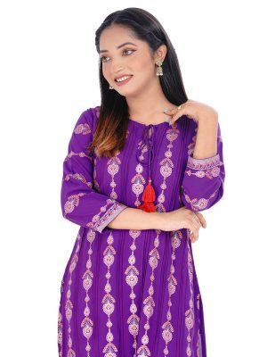 Purple all-over printed straight-cut kameez in Georgette fabric. Features a round neck with tasseled cords and three-quarter sleeves. Embellished with pin tucks and embroidery at the front. Patch attachment at the cuffs. Unlined.