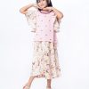 Pink Top-Skirt set in Georgette fabric. The top is designed with a round neck and butterfly sleeves. Embellished with embroidery at the front. Button opening at the back. Paired with a gathered skirt as the bottom.