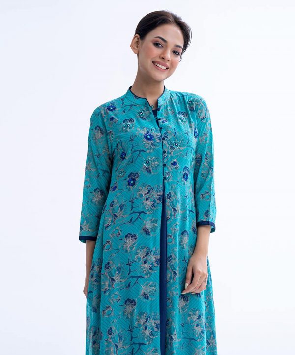 Blue shrug style Tunic in Georgette fabric and inner in Crepe fabric. Designed with a band collar and three-quarter sleeves. Embellished with karchupi at the front. Spliced gather hemline.