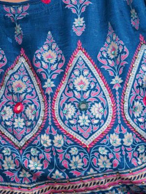 Blue all-over printed A-line Tunic in textured Silk-blend fabric. Designed with a round neck and three-quarter sleeves. Embellished with karchupi at the top front and cuffs. Viscose lining in half-body. Single button opening at the back.