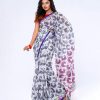 White all-over printed Cotton Saree with a blue border.