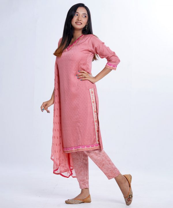 Pink printed Salwar Kameez in textured Silk-blend and Crepe fabric. The Kameez is designed with a V-neck and three-quarter sleeves. Embellished with embroidery at the neckline. Complemented by Crepe palazzo pants and a Chiffon dupatta.