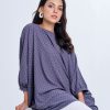 Gray all-over printed abaya style Tunic in Georgette fabric. Designed with a round neck and batwing dolman sleeves. Single button opening at the back. Unlined.