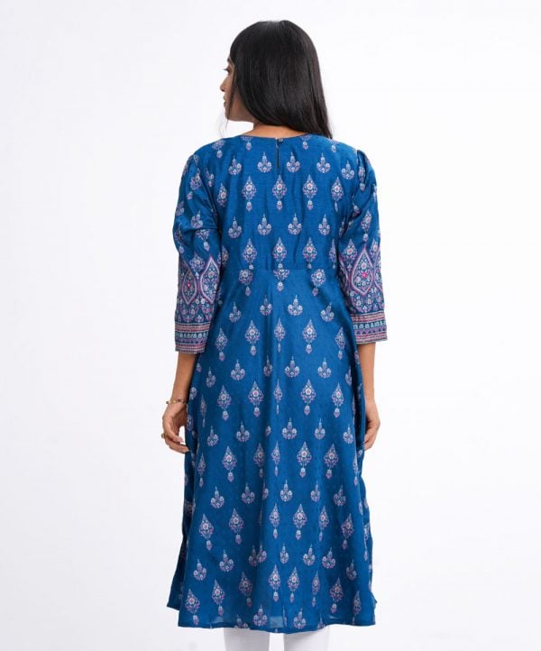 Blue all-over printed A-line Tunic in textured Silk-blend fabric. Designed with a round neck and three-quarter sleeves. Embellished with karchupi at the top front and cuffs. Viscose lining in half-body. Single button opening at the back.