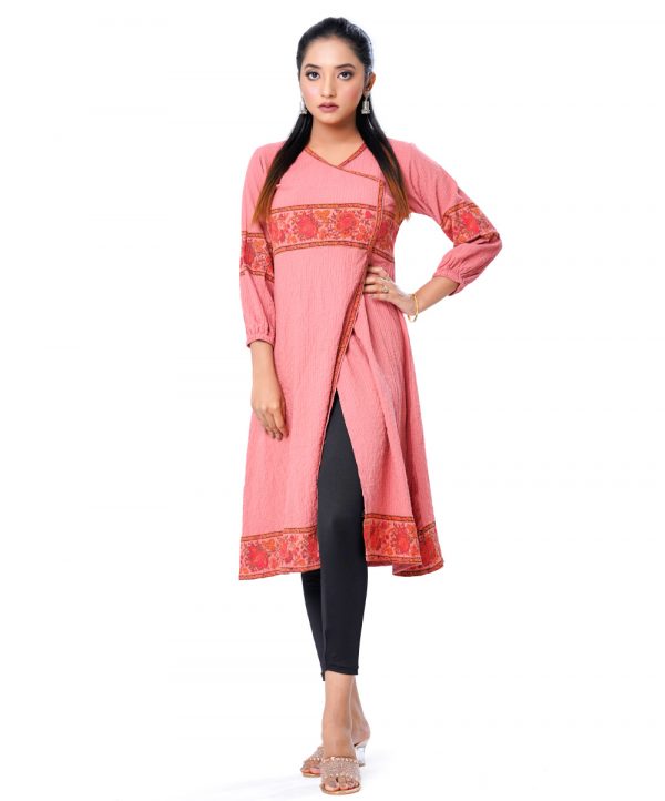 Peach retro-wrap style Kameez in Georgette fabric. Designed with a V-neck and bishop sleeves.