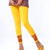 Yellow legging in stretchable cotton knit fabric with prints on the border. Concealed elastication on the waistline.