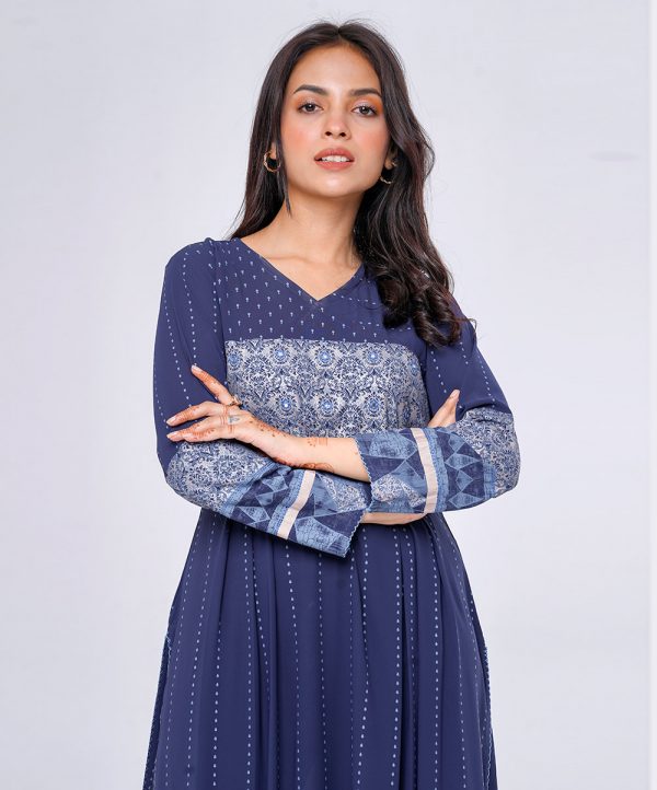 Navy Blue wrap style angrakha style Kameez in Georgette fabric. Designed with a V-neck and full sleeves. Embellished with embroidery at the top front and cuffs. Pleats from the waistline. Single button opening at the back. Unlined.