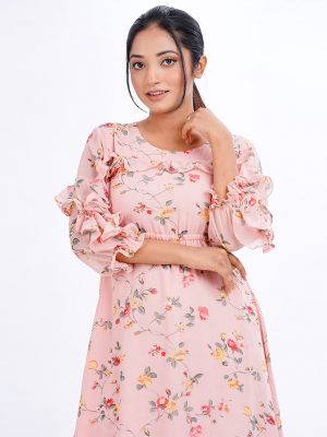 Peach A-line Tunic in printed Georgette fabric. Designed with a round neck and cinched bishop sleeves. Detailed with extended ruffle till sleeves cuffs at both sides. Single button opening at the back.