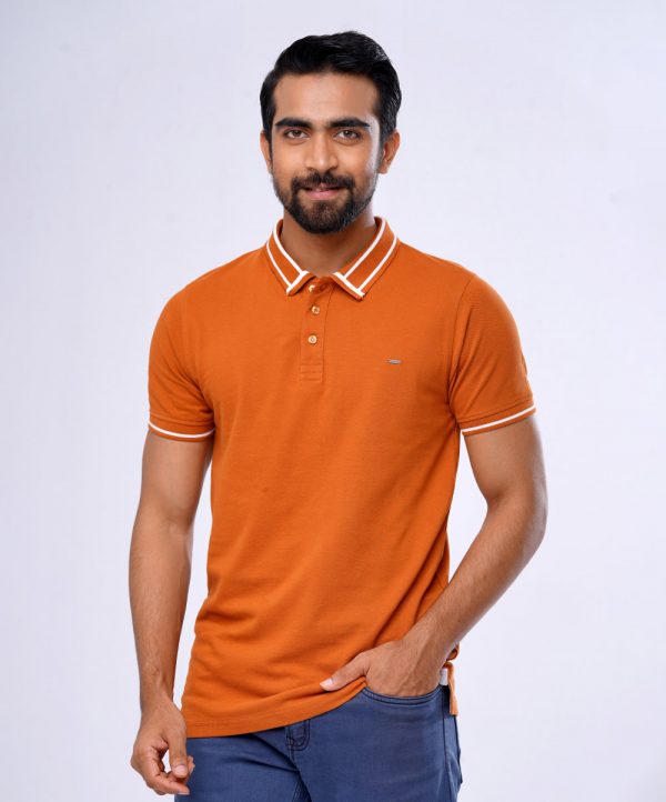 Orange Polo Shirt in Cotton pique fabric. Designed with a classic collar, short sleeves, and a metal logo attachment at the chest. Contrast tipping at collar and cuffs.