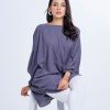 Gray all-over printed abaya style Tunic in Georgette fabric. Designed with a round neck and batwing dolman sleeves. Single button opening at the back. Unlined.