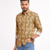 Brown casual shirt in paisley printed Cotton fabric. Designed with a classic collar and long sleeves with adjustable buttons at the cuffs. Slim fit.