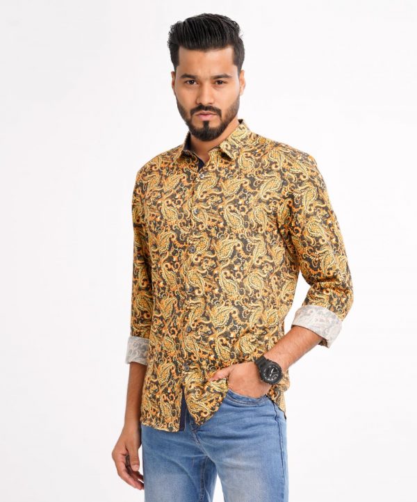 Brown casual shirt in paisley printed Cotton fabric. Designed with a classic collar and long sleeves with adjustable buttons at the cuffs. Slim fit.