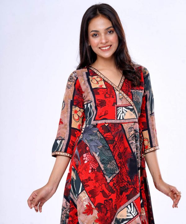 Red and Black all-over printed Retro-wrap style long Tunic in Georgette fabric. Designed with a V-neck and three-quarter sleeves. Printed patch attachment at the front and cuffs. Detailed with adjustable tasseled waist cords at the front.