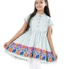 Mint Blue Tunic in Crepe fabric. Feature a round neck with button opening at the front and cap sleeves. Designed with ruffles at the front and gathers from the waistline. Viscose lining in half-body.