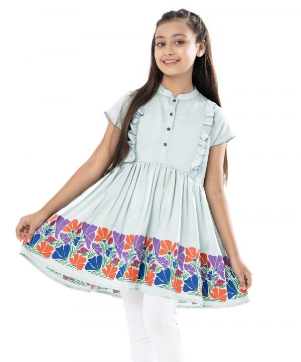 Mint Blue Tunic in Crepe fabric. Feature a round neck with button opening at the front and cap sleeves. Designed with ruffles at the front and gathers from the waistline. Viscose lining in half-body.