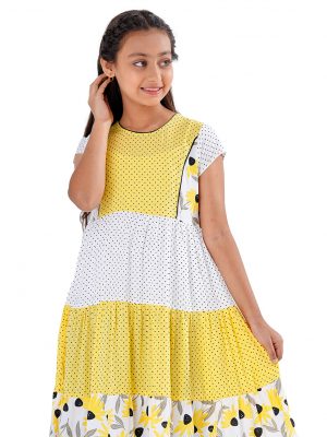 White and Yellow tiered pattern frock in Viscose fabric. Designed with a princess line cut and sew at the top front, cap sleeves and a round neck.