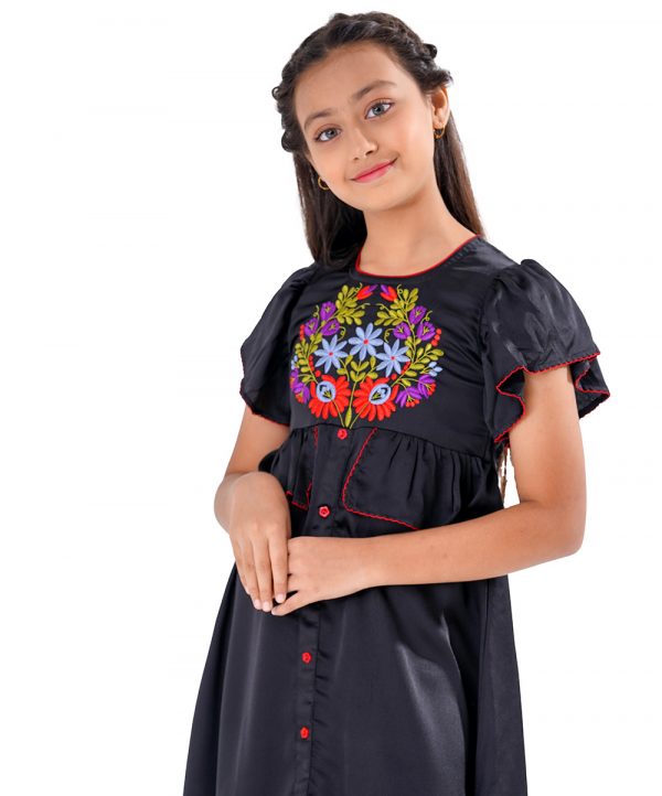 Black A-line Frock in Crepe fabric. Designed with a round neck and butterfly sleeves. Embellished with embroidery at the front. Detailed with extended ruffles around the waistline. Viscose lining in half-body. Zipper closure at the back.