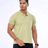Lemon green short-sleeved Polo shirt in Cotton inject fabric. Classic collar with front button fastening.