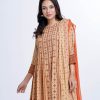 Brown all-over printed Salwar Kameez in Viscose fabric. The Kameez features a round neck and three-quarter sleeves. Designed with pin tucks detailed at the top front and gathers from the waistline. Embellished with karchupi at the top front, cuffs and hemline. Complemented by Viscose culottes pants and printed chiffon dupatta.