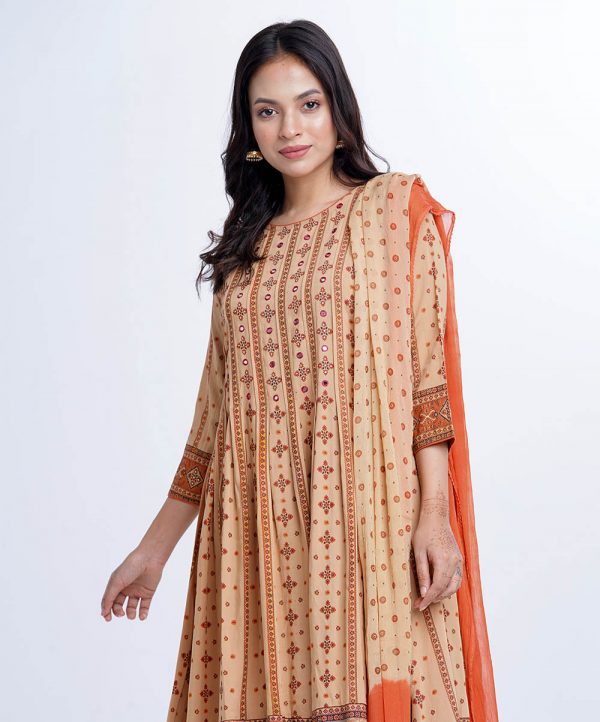Brown all-over printed Salwar Kameez in Viscose fabric. The Kameez features a round neck and three-quarter sleeves. Designed with pin tucks detailed at the top front and gathers from the waistline. Embellished with karchupi at the top front, cuffs and hemline. Complemented by Viscose culottes pants and printed chiffon dupatta.