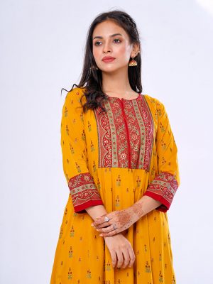 Mustard all-over printed pattern A-line Long Tunic in Viscose fabric. Features a band collar with hook closure at the front and three-quarter sleeves. Embellished with embroidery at the top front. Printed patch attachment at the cuffs.