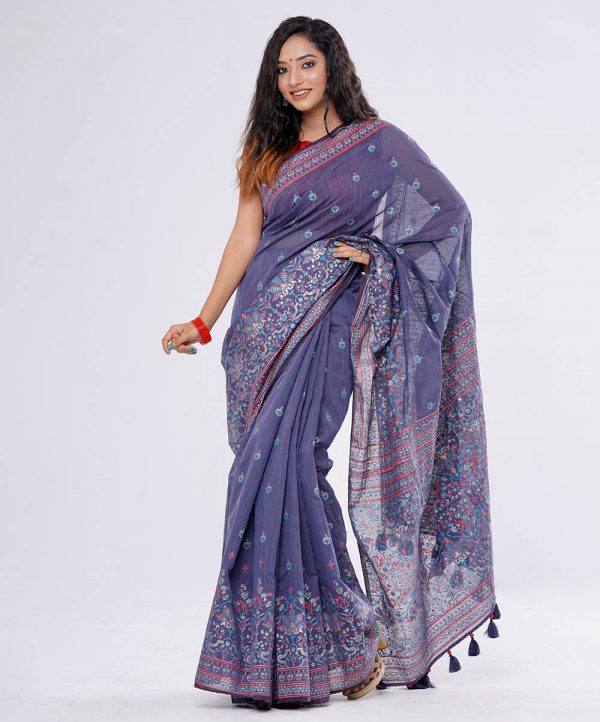Blue all-over printed Saree in Half silk fabric. Embellished with karchupi and decorative tassels on the achal.