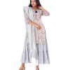 White all-over printed Salwar Kameez suit with a tiered-patterned long gown and printed Kameez as a layer. Designed with a tie-cord neckline and jeweled tassels on the slits. Complemented with printed half-silk dupatta and Pajamas.