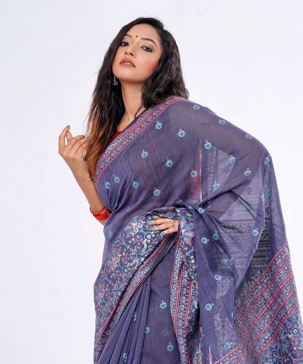 Blue all-over printed Saree in Half silk fabric. Embellished with karchupi and decorative tassels on the achal.