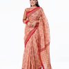 Brown all-over printed Cotton Saree with contrast red border. Embellished with embroidery on the achal.
