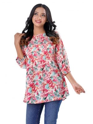 Pink A-line Tunic in printed Georgette fabric. Designed with a boat neck and bishop sleeves. Embellished with pin tucks at the top front. Unlined.