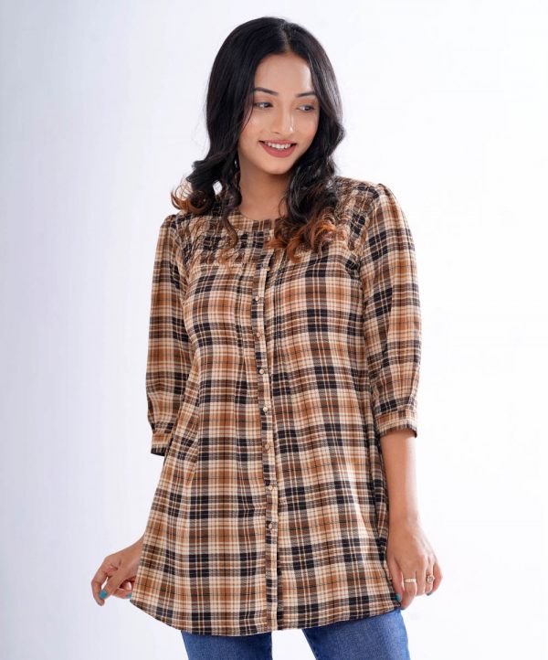 Brown ladies shirt in printed Georgette fabric. Designed with a band collar, front button opening and bishop sleeves.