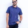 Blue Polo Shirt in Cotton knit fabric. Designed with a classic collar and short sleeves. Contrast tipping at collar and cuffs.