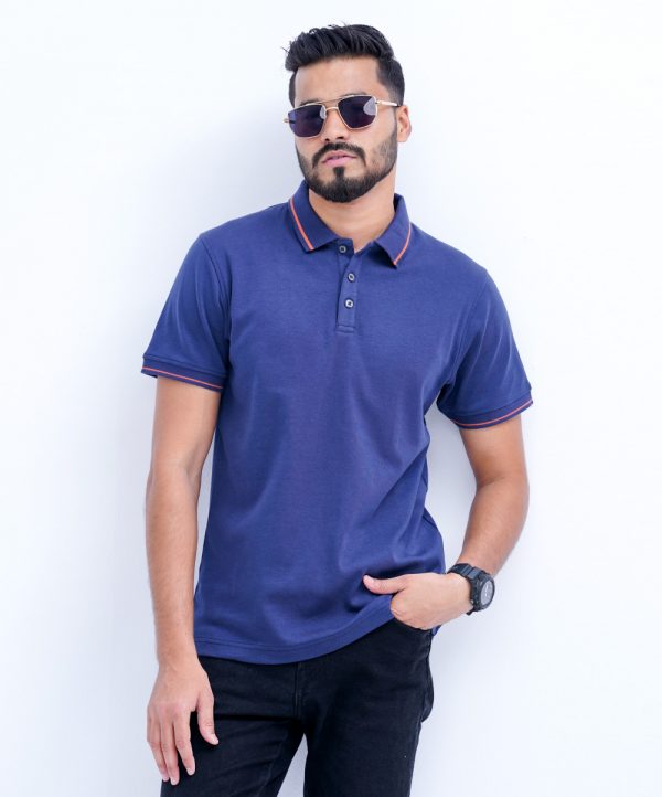 Blue Polo Shirt in Cotton knit fabric. Designed with a classic collar and short sleeves. Contrast tipping at collar and cuffs.