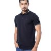 Black Polo in Cotton Pique fabric. Designed with a classic collar and short sleeves. Metal logo attached on the chest