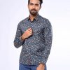 Black casual shirt in printed Cotton fabric. Designed with a classic collar and long-sleeved with adjustable button at cuffs. Slim fit.
