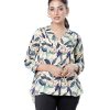 Brown Top in printed Georgette fabric. Features a V-neck with hook closure at the front and three-quarter sleeves with cuffs. Pleat at the front and gathers at the back. High-low hemline. Unlined.