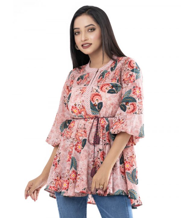 Peach tie-waist woven top in printed Georgette fabric. Designed with a band neck and balloon sleeves. Featuring tasselled tie-cord belt at the waist.