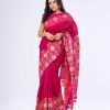 Magenta all-over printed Saree in Half silk fabric. Embellished with decorative tassels on the achal.