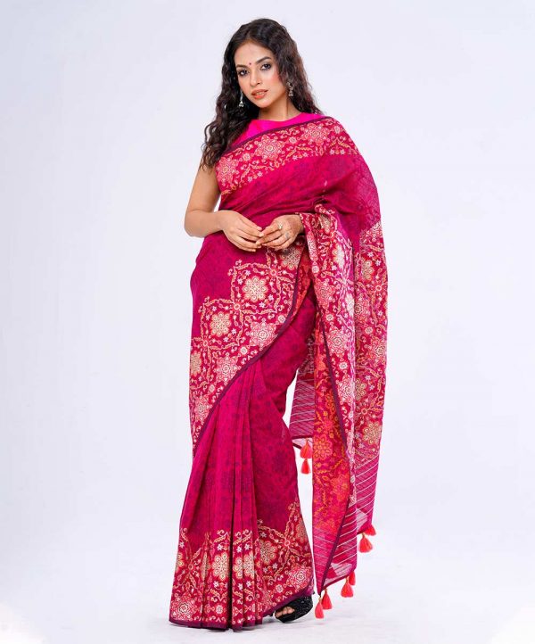 Magenta all-over printed Saree in Half silk fabric. Embellished with decorative tassels on the achal.