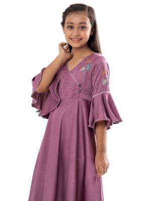 Pink retro-wrap style Frock in Crepe fabric. Designed with a V-neck and bell sleeves. Embellished with karchupi at the top front. Button opening at the back.